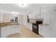 Spacious kitchen features ample white cabinetry, modern appliances, and eat-in breakfast nook at 198 Hillsdale Dr, Archer Lodge, NC 27527