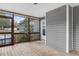Enclosed screened porch area with wood flooring, a porch door and exterior siding at 198 Hillsdale Dr, Archer Lodge, NC 27527
