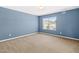 Spacious bedroom with a large window letting in natural light at 2 Bolter Ct, Durham, NC 27704