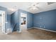 Neutral carpeting in bedroom with doorway and stairway at 2 Bolter Ct, Durham, NC 27704