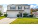 Traditional two-story home featuring a two-car garage, manicured lawn, and neutral siding at 2 Bolter Ct, Durham, NC 27704