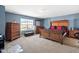 Main bedroom with a window, bedroom furniture, and neutral carpeting at 2 Bolter Ct, Durham, NC 27704