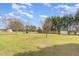 Spacious backyard with a swing set and shed, perfect for recreation and relaxation at 201 Alice Dr, Garner, NC 27529
