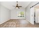 Spacious bedroom with vaulted ceiling, ceiling fan, and barn door to ensuite bathroom at 201 Alice Dr, Garner, NC 27529