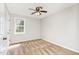 Cozy bedroom with a neutral color palette, ceiling fan, and a window at 201 Alice Dr, Garner, NC 27529