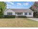Charming single-story home featuring blue shutters, a manicured lawn, and a welcoming front porch at 201 Alice Dr, Garner, NC 27529