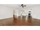 Open-concept living room with hardwood floors leading into a modern kitchen with stainless appliances at 201 Alice Dr, Garner, NC 27529