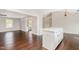 Open floorplan with hardwood floors and view into living room and kitchen island at 201 Alice Dr, Garner, NC 27529