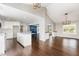 Expansive open-concept living area featuring hardwood floors, a kitchen island, and seamless flow at 201 Alice Dr, Garner, NC 27529