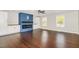Modern living room showcasing hardwood floors, a fireplace, and built-in storage at 201 Alice Dr, Garner, NC 27529