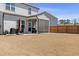 View of a fenced backyard with a screened in porch and outdoor furniture at 2040 Water Marsh Trl, Fuquay Varina, NC 27526