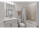 Well-maintained bathroom with a single sink, white countertop, toilet, and shower-tub combo with neutral tile at 2040 Water Marsh Trl, Fuquay Varina, NC 27526