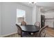 Cozy breakfast nook with a dark wood table and window offering natural light at 2040 Water Marsh Trl, Fuquay Varina, NC 27526
