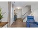 Warm and inviting foyer with beautiful hardwood floors and elegant staircase at 2040 Water Marsh Trl, Fuquay Varina, NC 27526