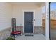 Close-up of the inviting front porch with welcome sign and charming decor at 2040 Water Marsh Trl, Fuquay Varina, NC 27526