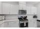 Updated kitchen showcasing stainless steel appliances and white subway tile backsplash at 2040 Water Marsh Trl, Fuquay Varina, NC 27526