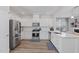 Modern kitchen featuring stainless steel appliances and white cabinetry at 2040 Water Marsh Trl, Fuquay Varina, NC 27526