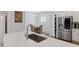 Kitchen view towards breakfast nook with stainless steel appliances and quartz countertops at 2040 Water Marsh Trl, Fuquay Varina, NC 27526