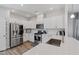 Bright kitchen featuring stainless steel appliances, white cabinetry, and quartz countertops at 2040 Water Marsh Trl, Fuquay Varina, NC 27526