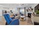 Comfortable living room with a fireplace, a ceiling fan, and an open floor plan at 2040 Water Marsh Trl, Fuquay Varina, NC 27526