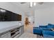 Bright living area with blue seating and a wooden coffee table and cabinetry near an upstairs hallway at 2040 Water Marsh Trl, Fuquay Varina, NC 27526