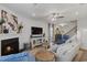 Inviting living room featuring a fireplace, modern furnishings, and neutral decor at 2040 Water Marsh Trl, Fuquay Varina, NC 27526