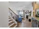 Inviting living room with fireplace, ceiling fan, and elegant staircase at 2040 Water Marsh Trl, Fuquay Varina, NC 27526