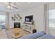 Comfortable living area with a fireplace and modern entertainment center at 2040 Water Marsh Trl, Fuquay Varina, NC 27526