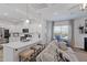 Inviting living space with kitchen view, a comfortable couch, and natural light at 2040 Water Marsh Trl, Fuquay Varina, NC 27526
