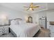 A spacious main bedroom featuring a tray ceiling and an ensuite bathroom for added convenience at 2040 Water Marsh Trl, Fuquay Varina, NC 27526