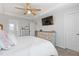 A luxurious main bedroom featuring tray ceilings and access to an ensuite bathroom at 2040 Water Marsh Trl, Fuquay Varina, NC 27526