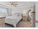 A beautiful main bedroom with tray ceilings, carpeted floors, and soft, elegant decor at 2040 Water Marsh Trl, Fuquay Varina, NC 27526