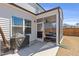 Screened porch with ceiling fan, outdoor furniture, and grill at 2040 Water Marsh Trl, Fuquay Varina, NC 27526
