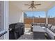 View of screened in porch with outdoor furniture, ceiling fan and grill at 2040 Water Marsh Trl, Fuquay Varina, NC 27526