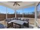 View of screened in porch with outdoor furniture and ceiling fan at 2040 Water Marsh Trl, Fuquay Varina, NC 27526