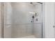 Modern tiled shower stall with glass doors and chrome fixtures for a sleek and functional bathroom design at 2040 Water Marsh Trl, Fuquay Varina, NC 27526