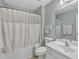 This bathroom includes a shower/tub combo, a single sink, and a large mirror at 2043 White Pond Ct, Apex, NC 27523