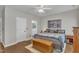 This cozy bedroom features hardwood floors, neutral walls, and an ensuite bathroom at 2043 White Pond Ct, Apex, NC 27523