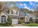 View of a beautiful townhome with a one car garage and a well manicured green lawn at 2043 White Pond Ct, Apex, NC 27523