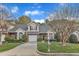 Attractive two-story townhome featuring a brick facade, garage, and landscaped front yard at 2043 White Pond Ct, Apex, NC 27523