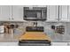 Close up of modern appliances in the kitchen and the countertops and cabinets at 2043 White Pond Ct, Apex, NC 27523