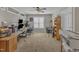 This bright home office features a ceiling fan, two windows, and multiple work stations at 2043 White Pond Ct, Apex, NC 27523