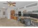 This cozy home office features a ceiling fan, drop lighting, and multiple work stations at 2043 White Pond Ct, Apex, NC 27523