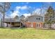 The home features a spacious backyard with a large deck, ideal for entertaining and relaxation at 215 Longview Dr, Smithfield, NC 27577