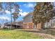 Expansive backyard featuring a deck, patio, and mature trees perfect for outdoor living at 215 Longview Dr, Smithfield, NC 27577
