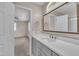 Bathroom featuring a sink with gray cabinets, granite countertop, and updated faucet at 215 Longview Dr, Smithfield, NC 27577