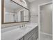 Bathroom with a large mirror, updated vanity, modern fixtures, and a glass shower door at 215 Longview Dr, Smithfield, NC 27577