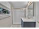 Bright bathroom featuring a glass door shower and modern vanity at 215 Longview Dr, Smithfield, NC 27577