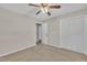 Bedroom with a ceiling fan and a view of the closet and hall entrances at 215 Longview Dr, Smithfield, NC 27577
