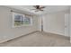 Bright bedroom with carpet, ceiling fan, and windows with natural light at 215 Longview Dr, Smithfield, NC 27577